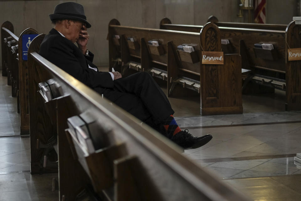 Francisco Fernandez, 95, sits on a pew at St. Peter the Apostle Catholic Church in Reading, Pa., on Sunday, June 2, 2024. (AP Photo/Luis Andres Henao)