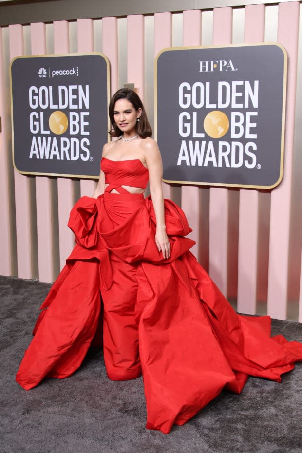BEVERLY HILLS, CALIFORNIA - JANUARY 10: Lily James attends the 80th Annual Golden Globe Awards at The Beverly Hilton on <a href="https://parade.com/living/january-holidays-observances" rel="nofollow noopener" target="_blank" data-ylk="slk:January;elm:context_link;itc:0;sec:content-canvas" class="link ">January</a> 10, 2023 in Beverly Hills, California. (Photo by Daniele Venturelli/WireImage)<p><a href="https://www.gettyimages.com/detail/1455609874" rel="nofollow noopener" target="_blank" data-ylk="slk:Daniele Venturelli/Getty Images;elm:context_link;itc:0;sec:content-canvas" class="link ">Daniele Venturelli/Getty Images</a></p>