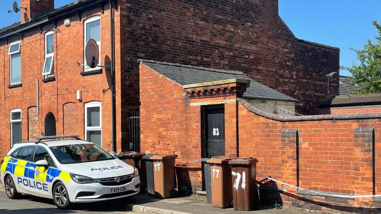 Police car outside a house