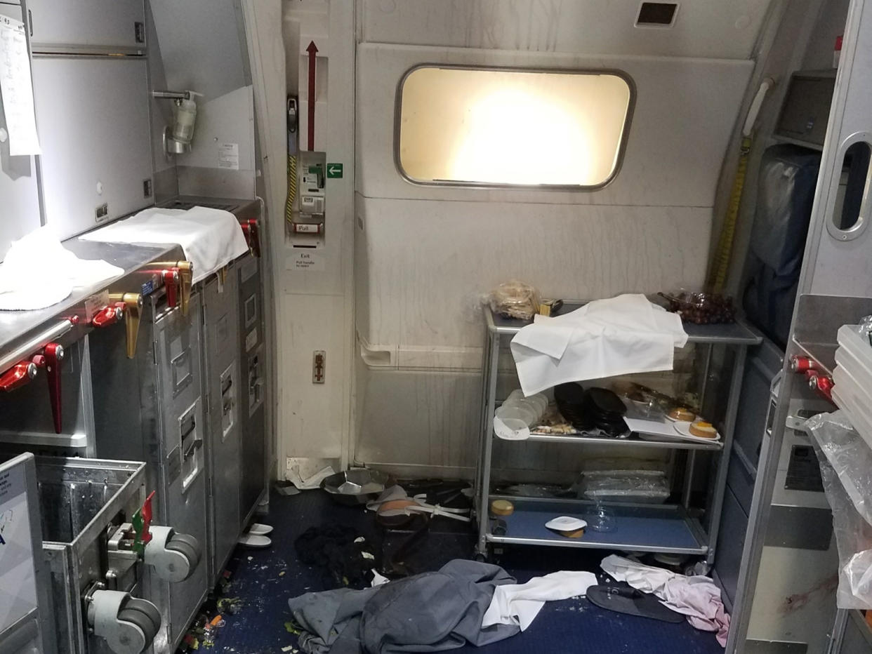 The aftermath of the incident on Delta Flight 129 from Seattle to Beijing: AP