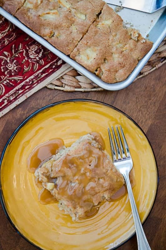 <p>From Valerie's Kitchen</p><p>Sweet peak-season apples baked into a cinnamon and nutmeg spiced cake and topped with an irresistible homemade butterscotch sauce.This sheet cake is guaranteed to get you in the mood for fall.</p><p><strong>Get the recipe:</strong><a href="https://www.fromvalerieskitchen.com/apple-cake-with-butterscotch-sauce/" rel="nofollow noopener" target="_blank" data-ylk="slk:Apple Cake with Butterscotch Sauce;elm:context_link;itc:0;sec:content-canvas" class="link rapid-noclick-resp"><strong> Apple Cake with Butterscotch Sauce</strong></a></p>