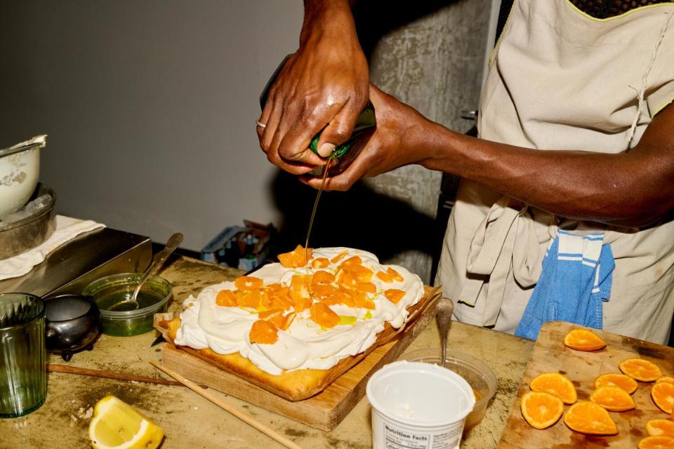 Olive oil is drizzled over a rum cake.