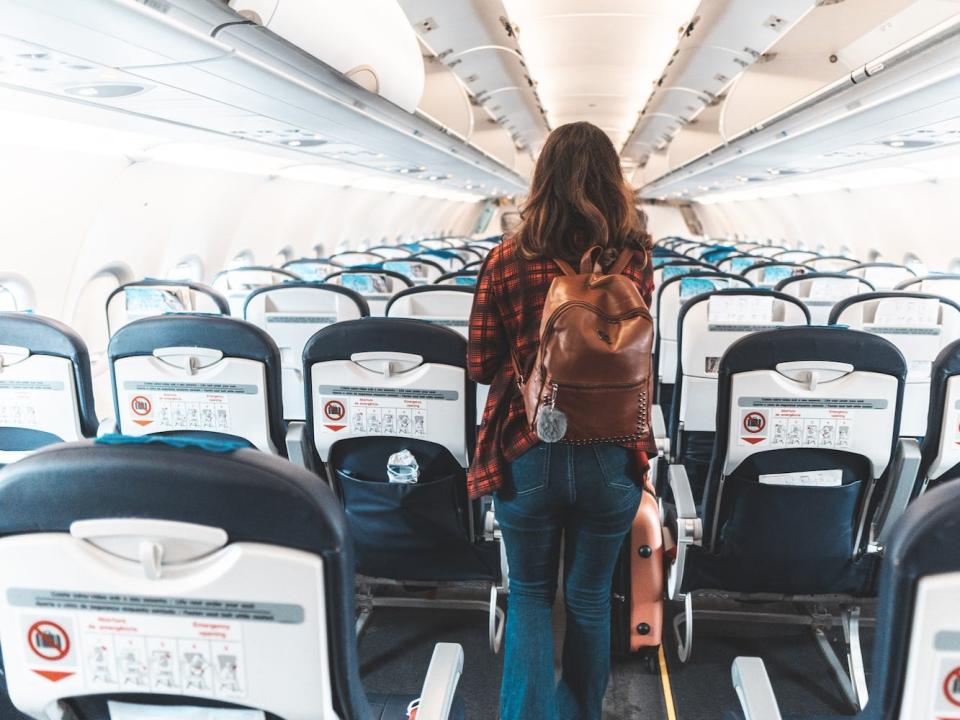 A person boards an airplane.