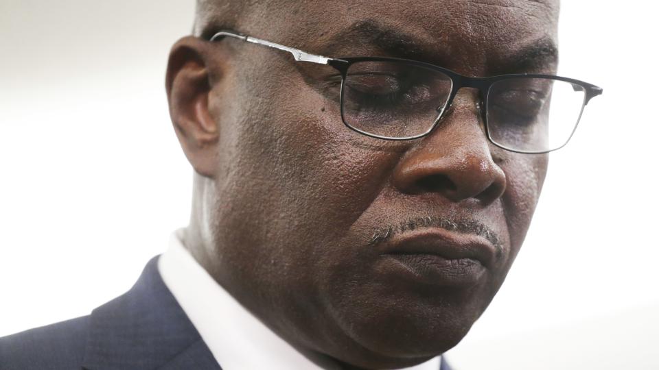 Buffalo Mayor Byron Brown takes a moment of silence and prayer following a shooting at a supermarket on Saturday, May 14, 2022, in Buffalo, N.Y.