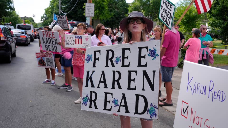 Supporters of Karen Read display signs near Norfolk Superior Court in Dedham on Monday. - Steven Senne/AP