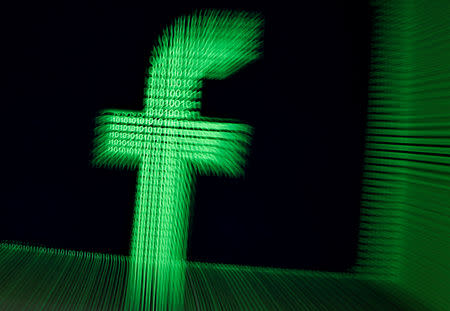 FILE PHOTO: A 3D-printed Facebook logo are seen in front of displayed binary digits in this illustration taken, March 18, 2018. REUTERS/Dado Ruvic/Illustration/File Photo