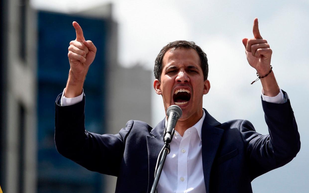 Venezuela's National Assembly head Juan Guaido, speaks to the crowd during a mass opposition rally against leader Nicolas Maduro in which he declared himself the country's acting president. - AFP