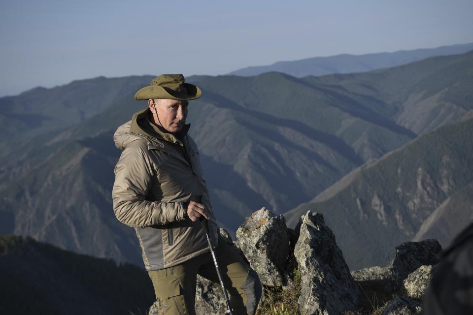 FILE - Russian President Vladimir Putin poses for a photo during a mini-break in the Siberian Tyva region, Russia on Sunday, Aug. 26, 2018. Vladimir Putin isn't quite the man he used to be — more than a decade has passed since the Russian president engaged in public stunts to boast of his vigor by hugging a polar bear or riding a horse barechested in the mountains. (Alexei Nikolsky/Sputnik, Kremlin Pool Photo via AP, File)