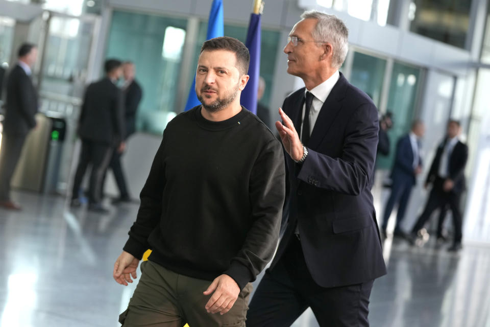 Ukraine's President Volodymyr Zelenskyy, left, walks with NATO Secretary General Jens Stoltenberg after addressing a media conference prior to a meeting of NATO defense ministers at NATO headquarters in Brussels, Wednesday, Oct. 11, 2023. (AP Photo/Virginia Mayo)