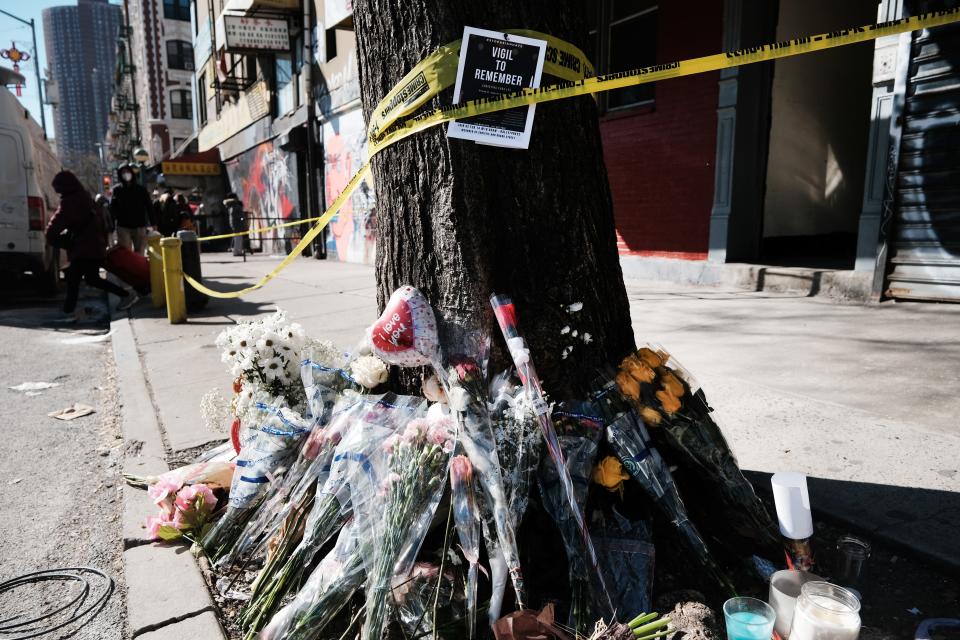 Flowers are set outside of the building  where Christina Yuna Lee was murdered in the early hours of February 13th after she was followed home on February 15, 2022 in New York City.