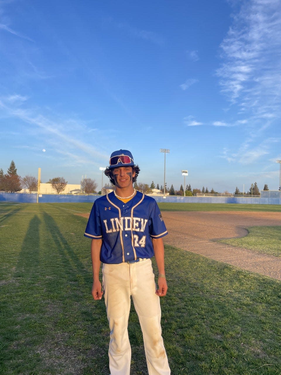 Linden's Beau Daluz posses for a photo after Tuesday's game against Bear Creek at Bear Creek High School.