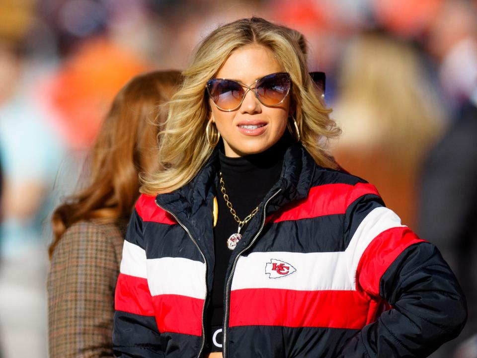 Gracie Hunt, the daughter of Kansas City Chiefs owner Clark Hunt, enjoys the sidelines before a game against the Denver Broncos at Empower Field at Mile High on December 11, 2022
