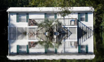 Water from the flooded Waccamaw River surrounds a house in the aftermath of Hurricane Florence now downgraded to a tropical depression in Conway, South Carolina, U.S. September 19, 2018. REUTERS/Randall Hill