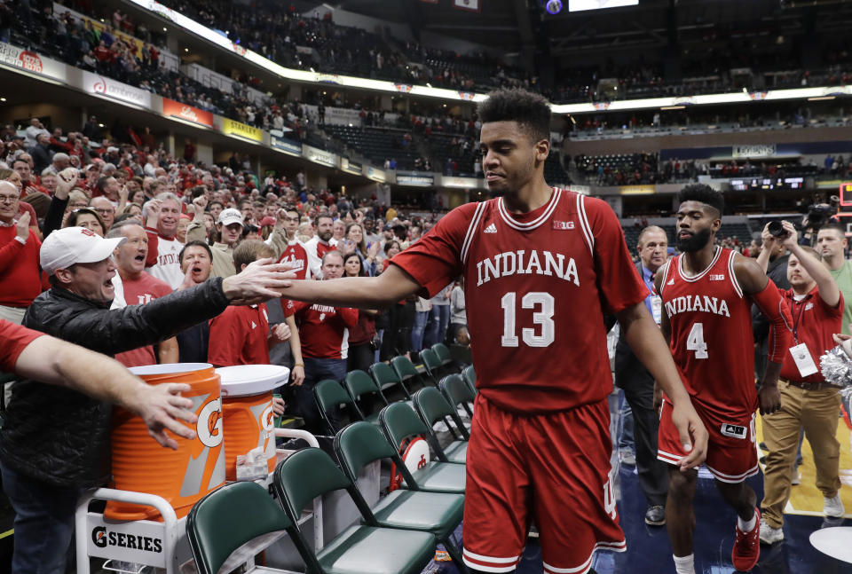 Indiana’s Juwan Morgan (13) celebrates with fans after Indiana defeated Notre Dame, 80-77, in an NCAA college basketball game, Saturday, Dec. 16, 2017, in Indianapolis. (AP Photo/Darron Cummings)