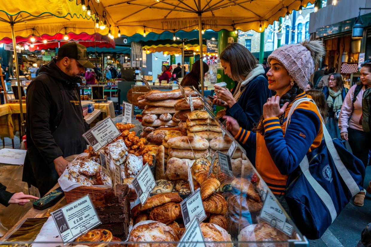 inflation Young People Buying Bread From Olivier's Bakery, Borough Market, London, UK