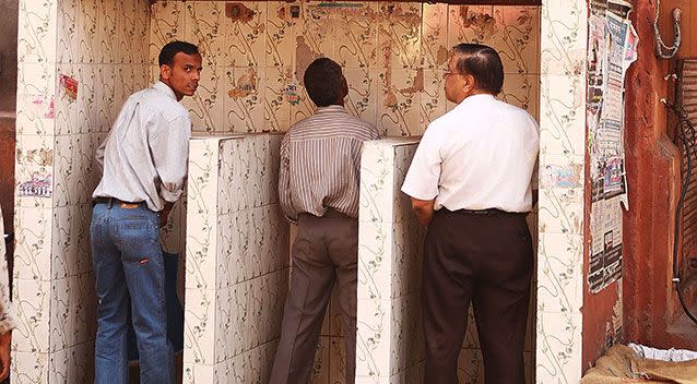 Men use a public urinal at the local markets in the walled city centre of Jaipur. Source: Getty Images