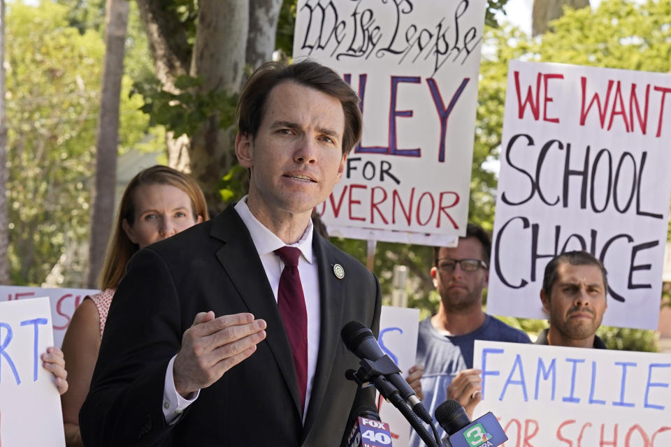 FILE — In this July 21, 2021 file photo Assemblyman Kevin Kiley, of Rocklin, a Republican candidate for governor in the Sept. 14 recall election, campaigns for school choice outside a charter school in Sacramento, Calif. Kiley is running to replace Democratic Gov. Gavin Newsom in the Sept. 14 recall election. Democrats hope hope they can keep Newsom in office by driving up turnout. (AP Photo/Rich Pedroncelli, File)