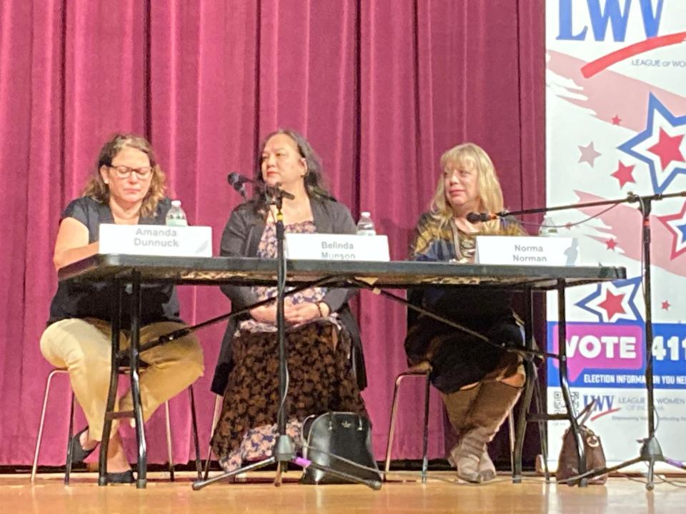 Muncie City Court Judge Amanda Dunnuck, left, Muncie City Clerk Belinda Munson, center, and city clerk candidate Norma Norman, on stage at Muncie Central High School for a local candidate forum Wednesday night.