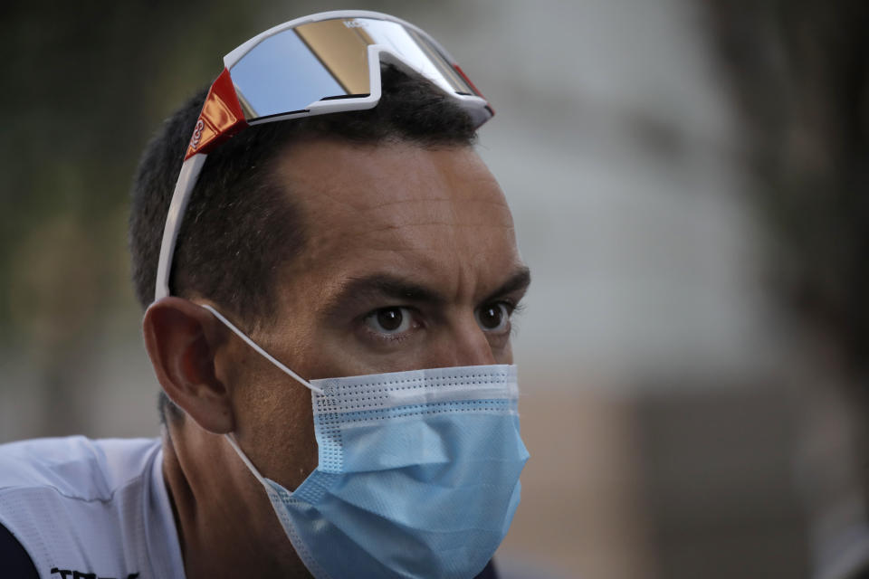 Australia's Richie Porte wears a face mask as he arrives for the 107th Tour de France cycling race team presentation, in Nice, southern France, Thursday, Aug. 27, 2020 ahead of upcoming Saturday's start of the race. The Tour de France sets off shrouded in uncertainty and riding in the face of the coronavirus pandemic and mounting infections in France. (AP Photo/Christophe Ena)