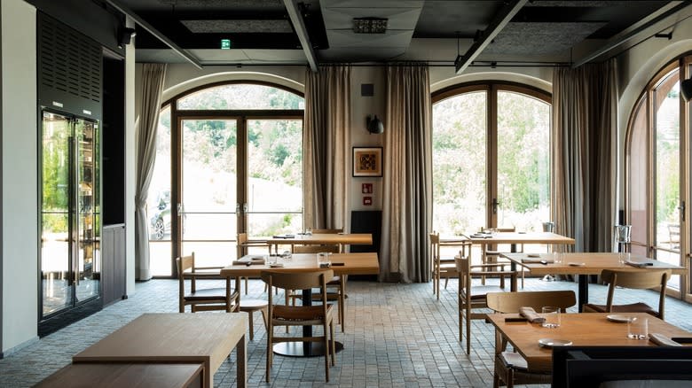 Interior restaurant dining room with large windows