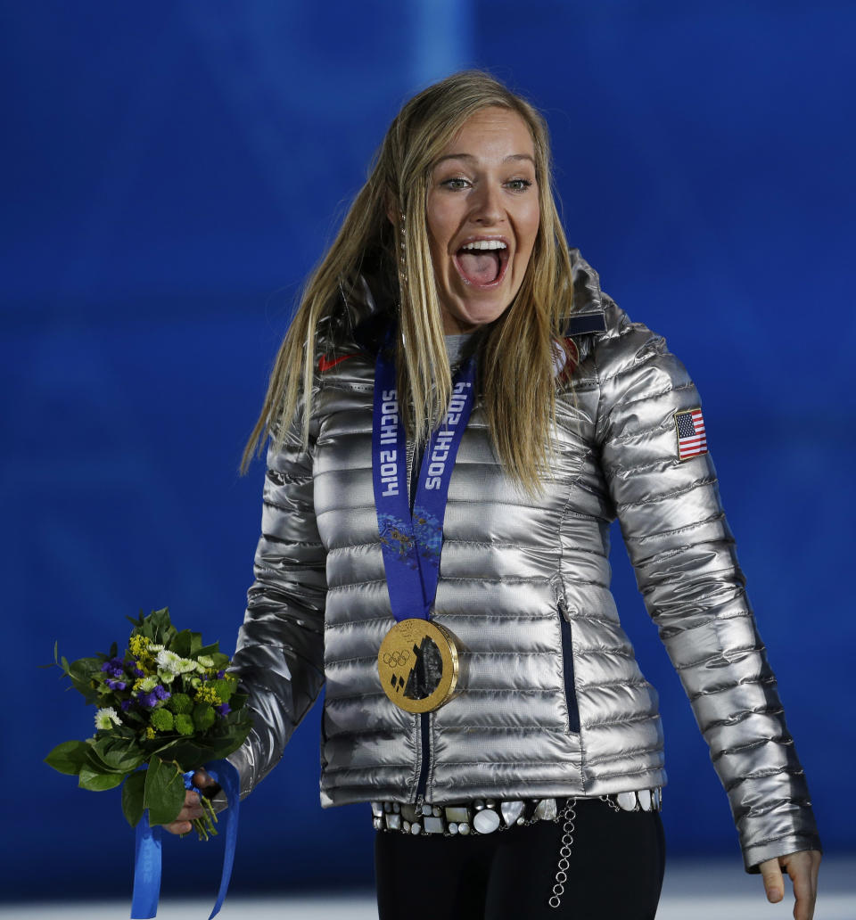 Gold medalist in the women's snowboard slopestyle Jamie Anderson of the United States smiles during the medals ceremony at the 2014 Winter Olympics, Sunday, Feb. 9, 2014, in Sochi, Russia. (AP Photo/Morry Gash)