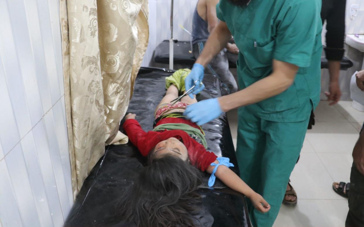 A child wounded in airstrikes is treated at an Idlib region hospital in May.  - Anadolu