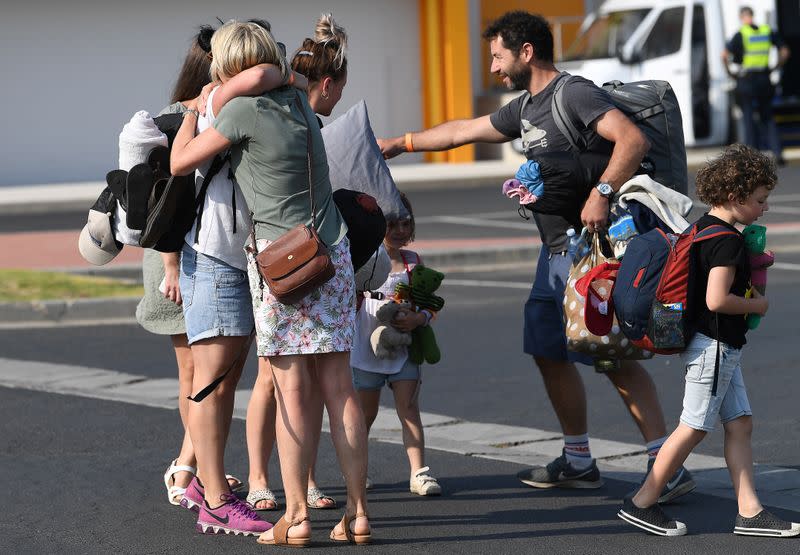 Mallacoota bushfires evacuees, who arrived at the port of Hastings on MV Sycamore this morning, arrive at the Somerville Recreation Centre in Somerville south-east of Melbourne, Victoria,