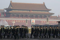 Chinese military delegates arrive for a meeting on the eve of the opening session of the National People's Congress held at the Great Hall of the People in Beijing, China, Monday, March 4, 2019. A year since removing any legal barrier to remaining China's leader for life, Xi Jinping appears firmly in charge, despite a slowing economy, an ongoing trade war with the U.S. and rumbles of discontent over his concentration of power. (AP Photo/Ng Han Guan)