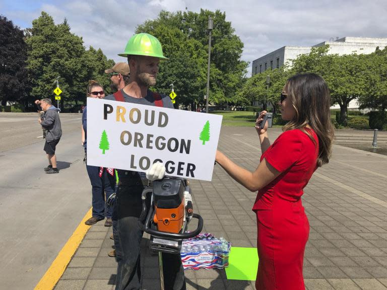 The Oregon Capitol will be closed on Saturday due to a "possible militia threat" from right-wing protesters as a walkout by Republican lawmakers over landmark climate change legislation drags on.Republican state senators fled the legislature — and some, the state — earlier this week to deny the majority Democrats enough votes to take up the climate bill, which would dramatically reduce fossil fuel emissions by 2050.It would be the second programme of its kind in the nation after California if passed.Governor Kate Brown then dispatched the state police to round up the rogue lawmakers, but none appeared in the Capitol on Friday and the stalemate seemed destined to enter its third day with a week left in the legislative session.Right-wing groups posted their support for the GOP lawmakers on social media on Friday — in one instance offering to provide escorts to them should the state police come for them.A group of local Republicans were set to protest inside the Capitol on Saturday when lawmakers were present, and anti-government groups threatened to join, prompting the statehouse shutdown.One of the groups, the Oregon Three Percenters, joined an armed takeover of the Malheur National Wildlife Refuge in 2016. Dozens of people occupied the remote Oregon refuge for more than a month to protest federal control of Western lands.The standoff began to unravel when authorities fatally shot the group's spokesperson and arrested key leaders as they headed to a community meeting."The Oregon State Police has recommended that the Capitol be closed tomorrow due to a possible militia threat," Carol Currie, spokesperson for Senate president Peter Courtney, said in an e-mail to The Associated Press late on Friday.The governor's office also confirmed the threats.Oregon State Police, in a statement, said it has been "monitoring information throughout the day that indicates the safety of legislators, staff and citizen visitors could be compromised if certain threatened behaviours were realised."Also late on Friday, Mr Courtney and House speaker Tina Kotek, both Democrats, condemned comments made by senator Brian Boquist, a Republican from Dallas, Oregon, that urged the state police to "send bachelors and come heavily armed" when they come to bring him back to the Capitol."His comments have created fear among employees in our workplace," the leaders said in a joint statement. "We will always defend free speech and welcome frank policy discussions, but threats like these are unacceptable."Mr Boquist has not responded to multiple requests for comment. A spokesperson for Senate Republicans did not respond to queries about the statehouse closure.Democrats have an 18 to 12 majority in the chamber, but they need 20 members present for a quorum. One GOP senator recently died and has not yet been replaced.Under the proposed cap-and-trade bill, Oregon would put an overall limit on greenhouse gas emissions and auction off pollution "allowances" for each tonne of carbon industries plan to emit.The legislation would lower that cap over time to encourage businesses to move away from fossil fuels: The state would reduce emissions to 45 per cent below 1990 levels by 2035 and 80 per cent below 1990 levels by 2050.Those opposed to the cap-and-trade plan say it would exacerbate a growing divide between the liberal, urban parts of the state and the rural areas. The plan would increase the cost of fuel, damaging small business, truckers and the logging industry, they say.Democrats say the measure is an efficient way to lower emissions while investing in low-income and rural communities' ability to adapt to climate change. It has the support of environmental groups, farmworkers and some trade unions.California has had an economy-wide cap and trade policy like the one Oregon is considering for a decade. Nine northeastern states have more limited cap-and-trade programmes that target only the power sector.Associated Press