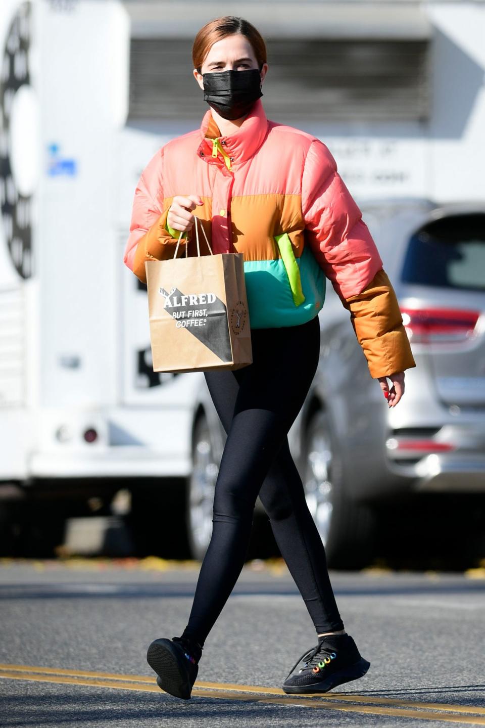 <p>Zoey Deutch bundles up in the colors of the rainbow for a coffee run in Los Angeles on Friday.</p>