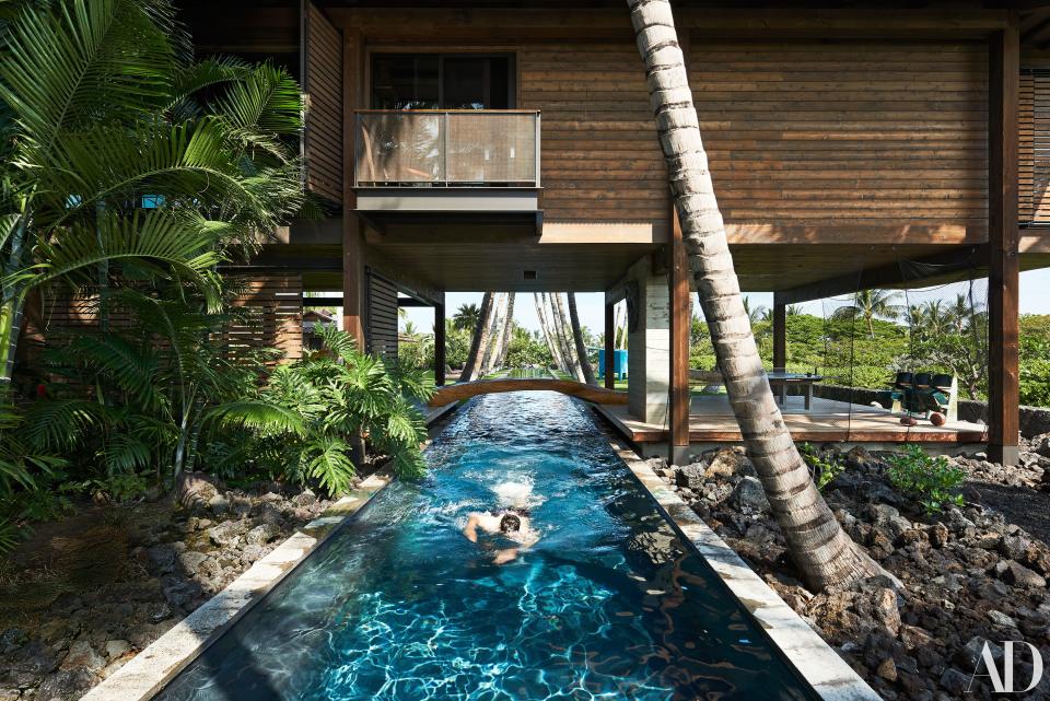 At a residence in Hawaii, a Hugo França tree-trunk bridge straddles the lap pool. Photo: Dominique Vorillon