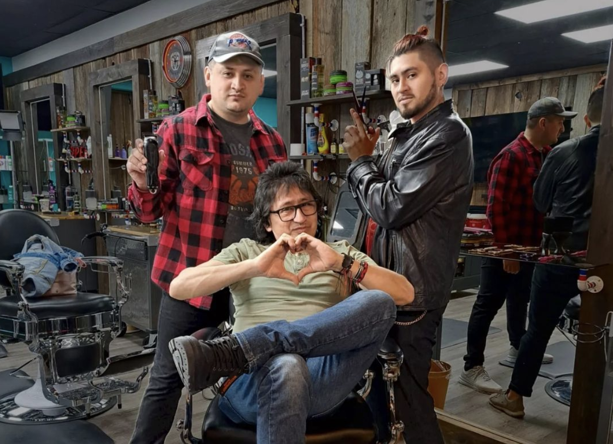 Rosso Villamil (centre) runs his barbershop with his two sons, Leonardo and Santiago, as well as other family members and barbers. (Photo via @rossobarberoshop_woodstock on Instagram)