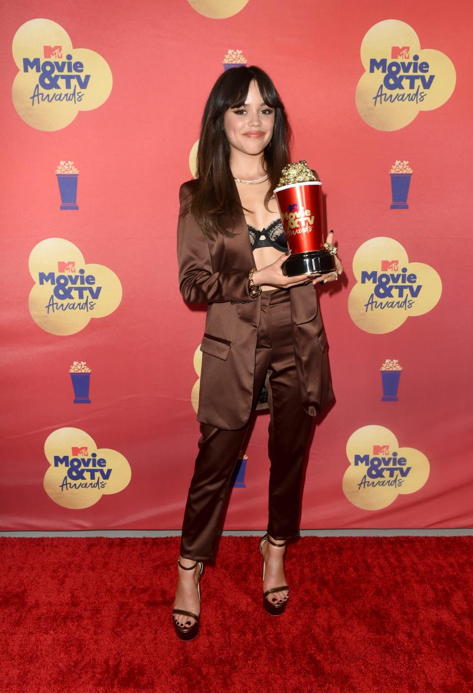 Jenna Ortega, winner of the Most Frightened Performance award for ‘Scream’, poses backstage during the 2022 MTV Movie & TV Awards at Barker Hangar on June 05, 2022 in Santa Monica, California.