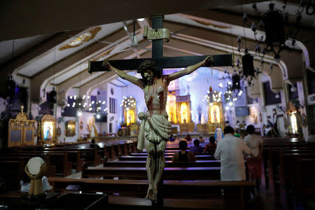 Devotees attend mass inside a Catholic church in Quezon City, metro Manila, Philippines September 22, 2017. REUTERS/Dondi Tawatao