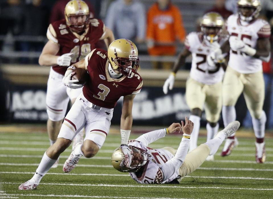 Boston College wide receiver Michael Walker (3) evades Florida State defensive tackle Marvin Wilson (21) during the first half of an NCAA college football game in Boston, Friday, Oct. 27, 2017. (AP Photo/Michael Dwyer)