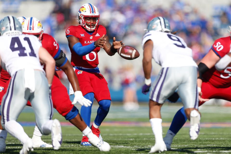 Kansas quarterback Jalon Daniels (6) takes a snap during the second half of the 2021 edition of the Sunflower Showdown against Kansas State at David Booth Kansas Memorial Stadium. The Jayhawks lost 35-10.