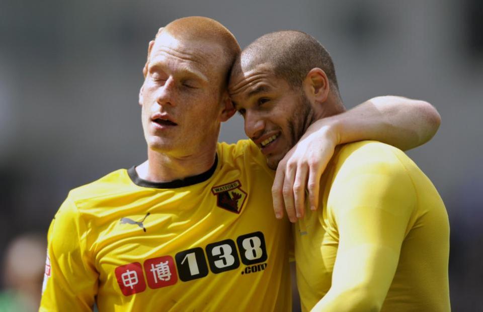 Watford Observer: An exhausted-looking Ben Watson embraces Adlene Guedioura