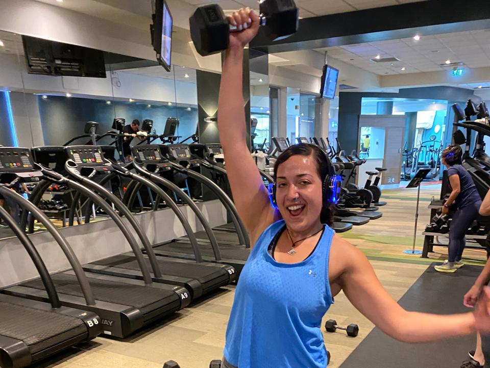 Reporter Urooba Jamal poses with a dumbbell.