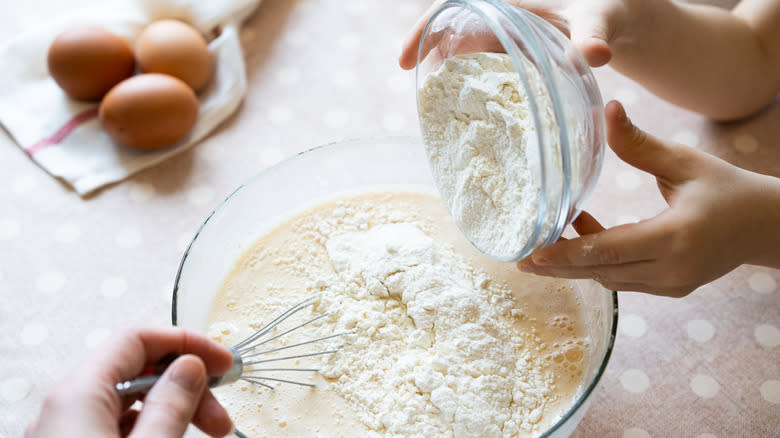 Pouring in flour pancake mix