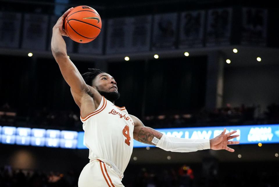 Texas guard Tyrese Hunter goes in for a dunk in the Longhorns' 94-80 win over Oklahoma in the regular-season finale Saturday at Moody Center. Hunter scored a career-high 30 points for the Longhorns, who will open the Big 12 Tournament Wednesday in Kansas City, Mo.