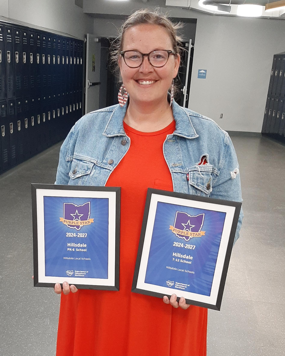Brooke Martin, Hillsdale's military family liaison, display certificates the schools received from the Ohio Department of Education and Workforce. Her leadership and efforts were instrumental in achieving the Purple Star designation. (PROVIDED BY HILLSDALE LOCAL SCHOOLS)