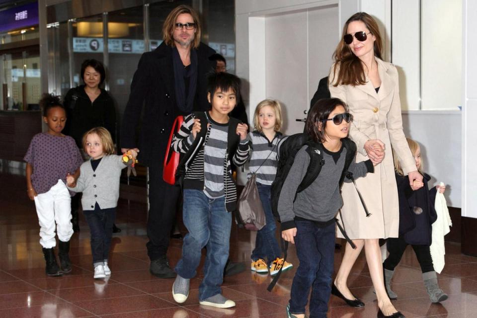 The Jolie-Pitt family arrive in Japan to promote Brad's new film 'Money Ball' (Masatoshi Okauchi/Rex)