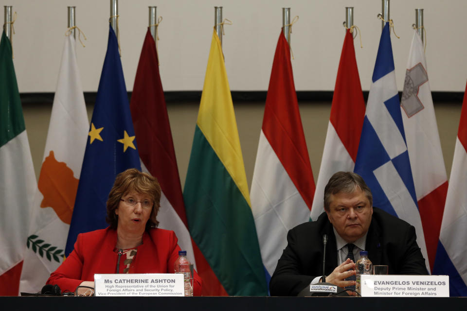 Vice President of the European Commission and High Representative of the Union for Foreign Affairs and security policy Catherine Ashton, left, speaks as Greek Foreign Minister Evangelos Venizelos listens, during a press conference following an informal meeting of EU Ministers for Foreign Affairs at Zappeion Hall in Athens, on Saturday, April 5, 2014. The Ukraine crisis has dominated the two-day informal talks among EU foreign ministers in Athens. (AP Photo/Kostas Tsironis)