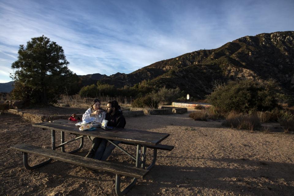 Hikers enjoy a picnic atop Echo Mountain.