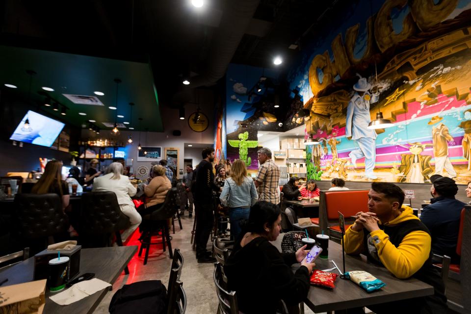 Customers enjoy their sandwiches at Cheba Hut "Toasted" Subs on their VIP party on Wednesday, Feb. 21, 2024. The new restaurant set to open on Feb. 23 is at 3001 N Zaragoza Road in East El Paso, TX.