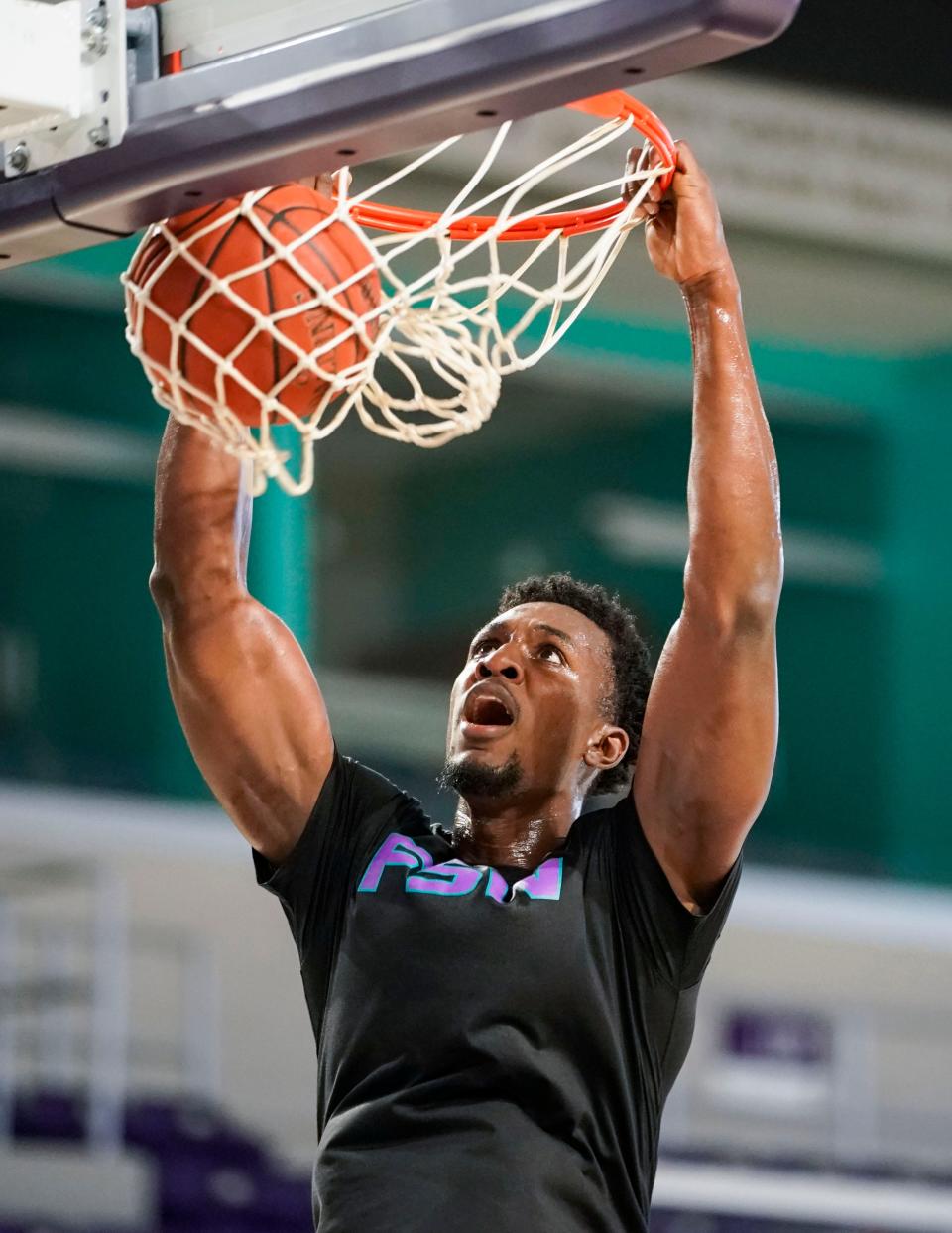 FSW forward Allen Udemadu dunks during practice at Suncoast Credit Union Arena in Fort Myers on Tuesday, February 28, 2023.