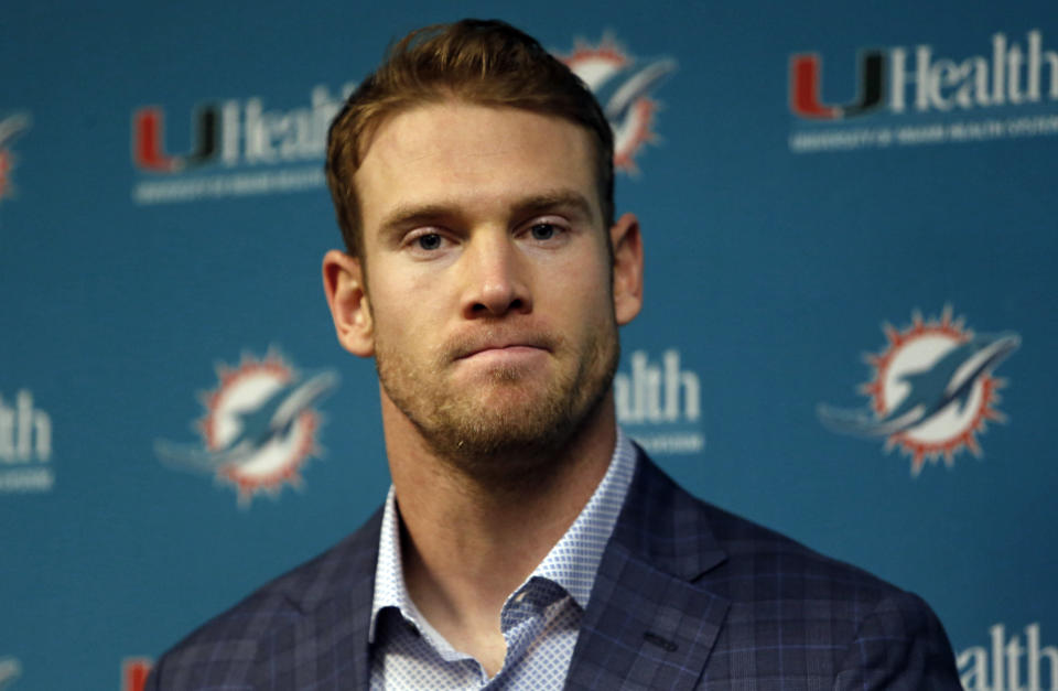 FILE - In this Dec. 30, 2018, file photo, Miami Dolphins quarterback Ryan Tannehill answers question during a news conference after an NFL football game against the Buffalo Bills, in Orchard Park, N.Y. Miami Dolphins quarterback Ryan Tannehill has been traded to the Tennessee Titans in a deal that also involves draft picks.Tannehill’s departure from Miami had been expected. He became the Dolphins’ starting quarterback as a rookie in 2012 and has still never taken a postseason snap. (AP Photo/Jeffrey T. Barnes, File)