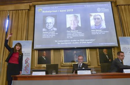 Professors Sara Snogerup Linse, Goran K. Hansson and Claes Gustafsson, members of the Nobel Assembly, talk to the media at a news conference at the Royal Swedish Academy in Stockholm October 7, 2015. REUTERS/Fredrik Sandberg/TT News Agency