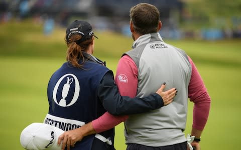 Lee Westwood of England and his caddie Helen Storey embrace on the eighteenth green during the final round of the 148th Open Championship held on the Dunluce Links at Royal Portrush Golf Club on July 21, 2019 in Portrush, United Kingdom - Credit: R&amp;A
