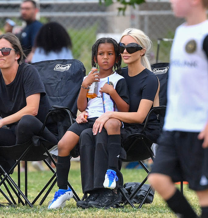 Kim Kardashian and her son Saint West at his soccer game in Los Angeles on May 15, 2022. - Credit: SplashNews.com